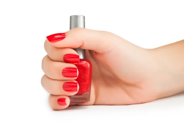 Ręce z czerwonym do manicure — Zdjęcie stockowe