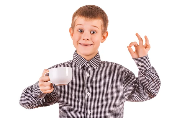 Funny cute boy with white cup of tea — Stock Photo, Image