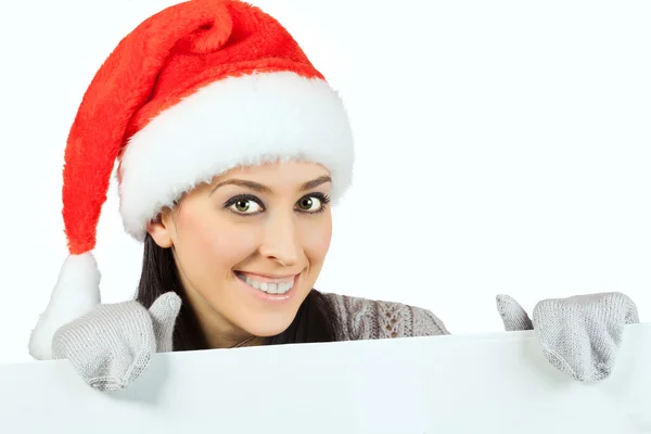 Rapariga sorridente de chapéu de Pai Natal. isolado — Fotografia de Stock