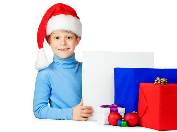 Happy kid with a lot of Christmas gifts — Stock Photo, Image