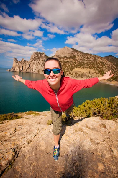 Happy girl on the mountain's top — Stock Photo, Image