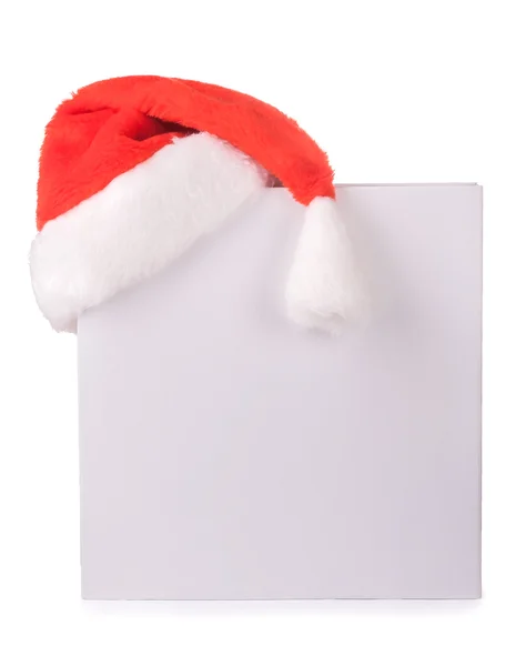 White box with a red Santa Claus hat. isolated — Stock Photo, Image