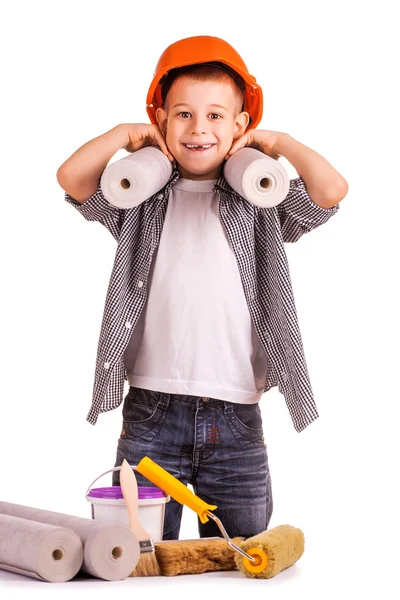 Kid with a roll of wallpaper and brush. isolated — Stock Photo, Image