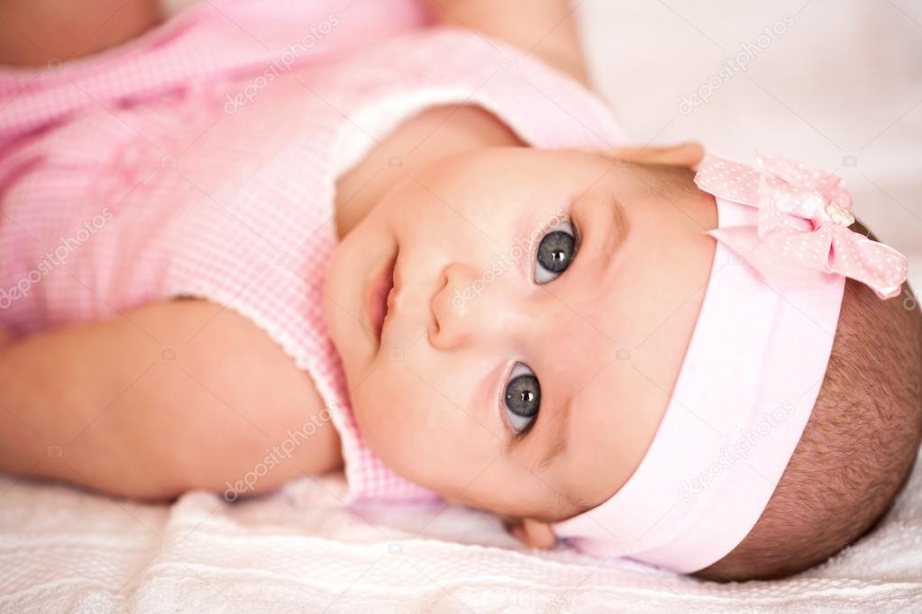 Cute baby girl in a pink dress