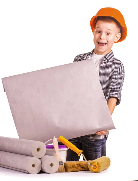 Kid with a rolls of wallpaper and brush. isolated — Stock Photo, Image
