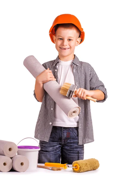 Ragazzo con un rotolo di carta da parati e pennello. isolato — Foto Stock