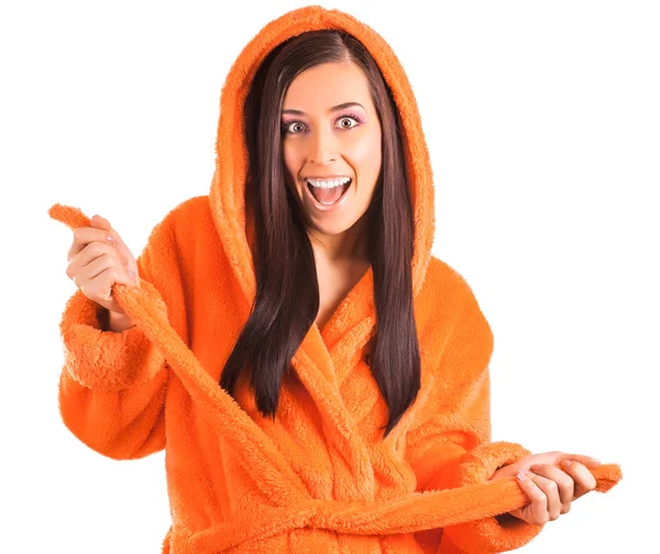 Cute brunette in an orange bathrobe — Stock Photo, Image