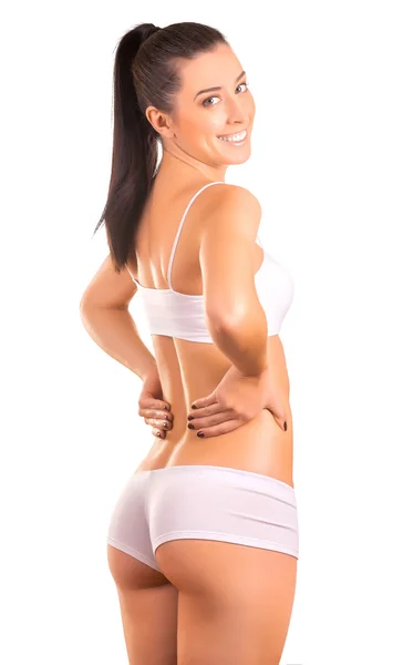 Happy woman athlete on a white — Stock Photo, Image