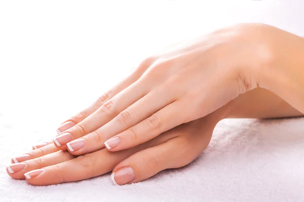 Beautiful manicure on the white towel — Stock Photo, Image