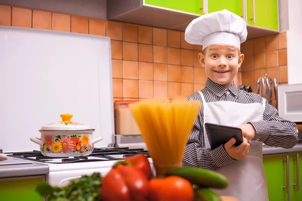 Boy chef is cooking on the kitchen — Stock Photo, Image