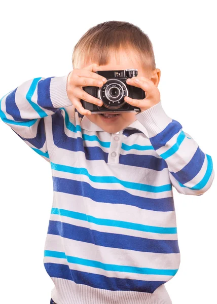 Menino com uma câmera em um fundo branco — Fotografia de Stock