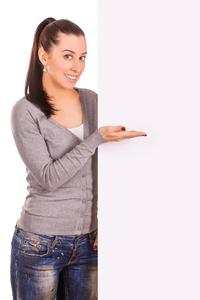Cute woman holding a banner isolated on white — Stock Photo, Image