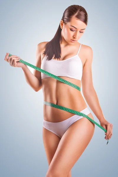 Cute Girl athlete with measuring tape — Stock Photo, Image