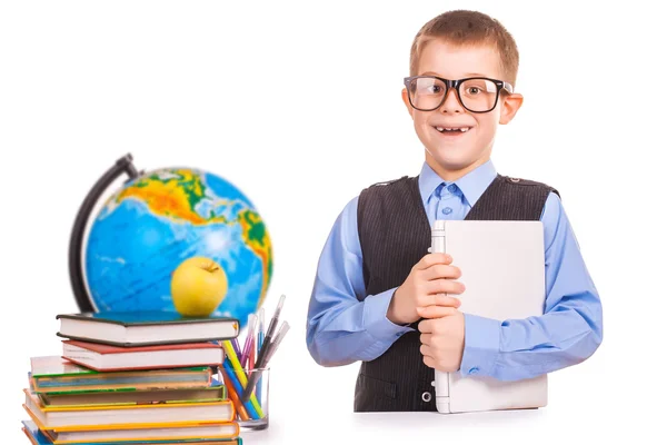 Школьник с книгами и ноутбуком на белом — стоковое фото