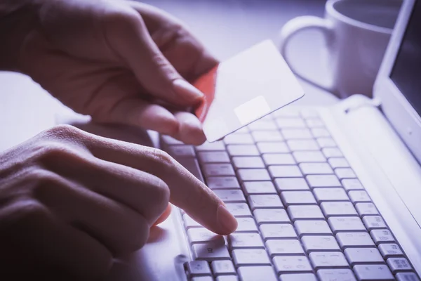 Online shopping. credit card in the hand — Stock Photo, Image