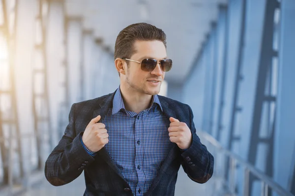 Businessman on the blue modern background — Stock Photo, Image