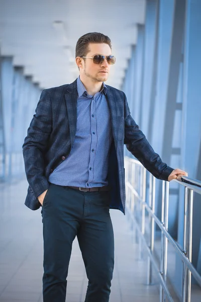 Businessman on the blue modern background — Stock Photo, Image