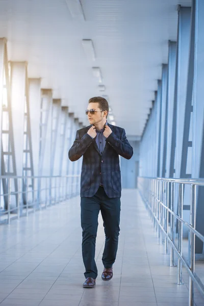 Businessman on the blue modern background — Stock Photo, Image