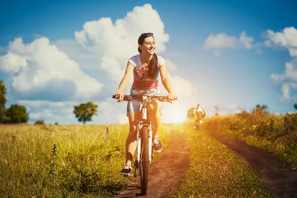 Woman riding bicycle — Stock Photo, Image
