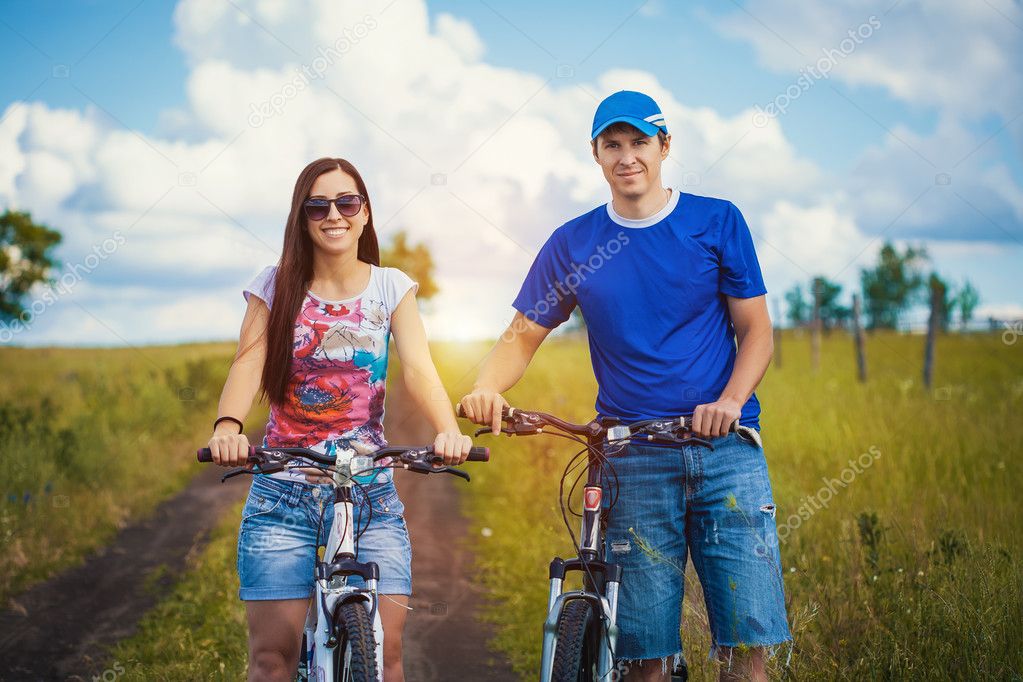Man and woman riding bicycles