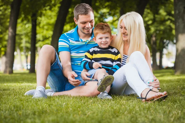 Happy family in the summer park — Stock Photo, Image