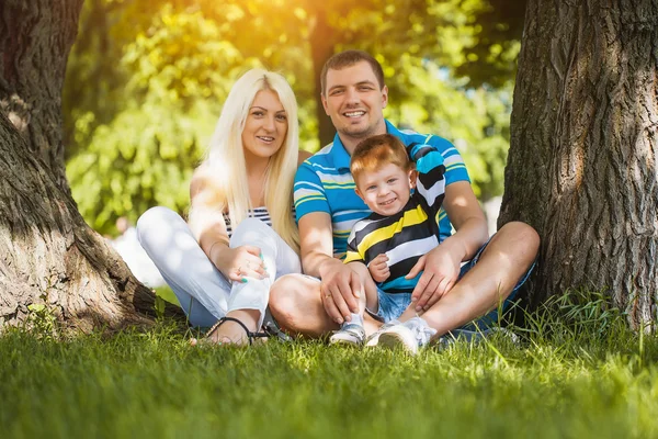 Happy family in the summer park — Stock Photo, Image