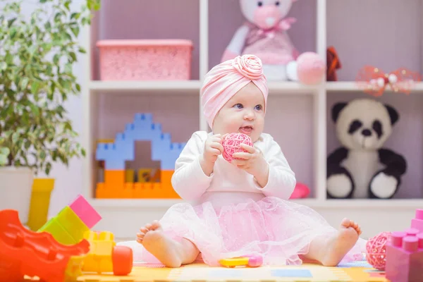 Baby playing with colourful building blocks at home or kindergarten — 图库照片