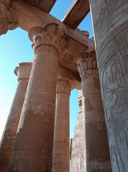 Ruins of an ancient egyptian temple with columns full of hieroglyphs in Egypt, Africa