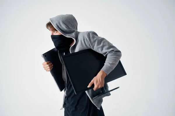 Anonimowość hakerów ostrożność balaclava tle światła — Zdjęcie stockowe