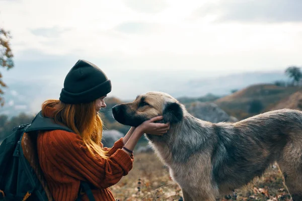 Woman hiker walking dog mountains landscape fresh air nature — Stock Photo, Image