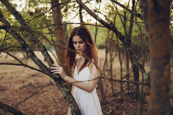 Woman in forest summer white dress nature fresh air. High quality photo