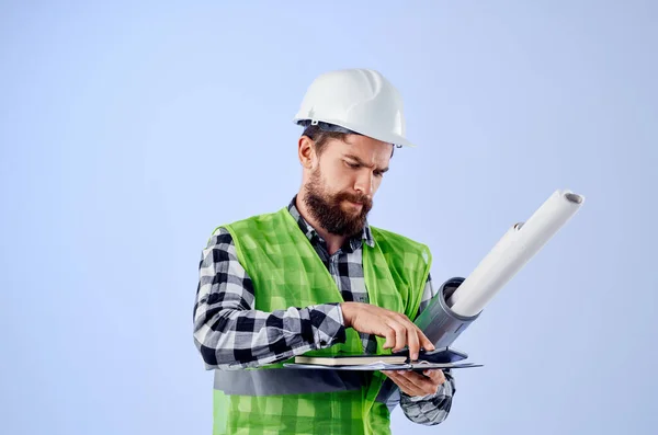 Engineer with documents and drawings blueprints blue background — Stock Photo, Image