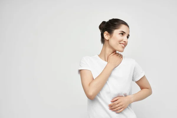 Woman holding on to the neck health care isolated background — Stock Photo, Image