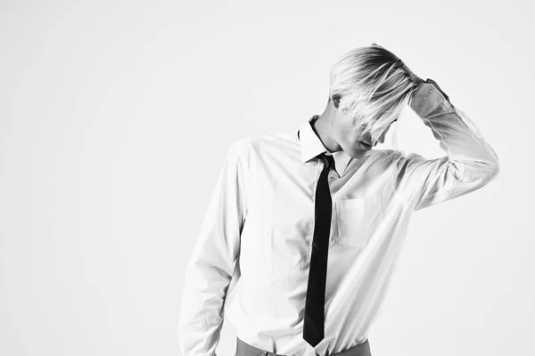 Portrait of a man in a shirt with a tie fashionable hairstyle Studio — Stock Photo, Image