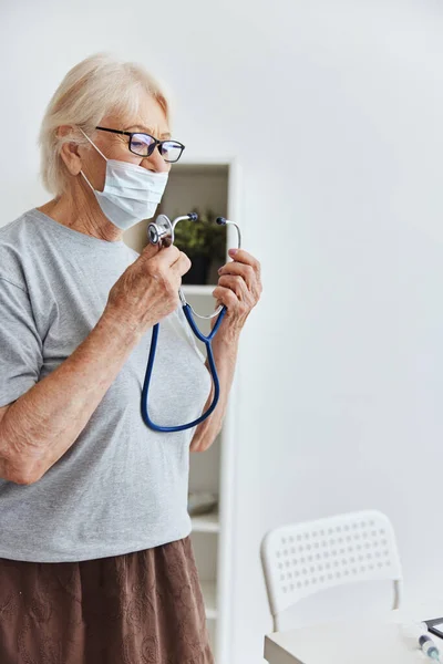 elderly woman stethoscope treatment hospital health