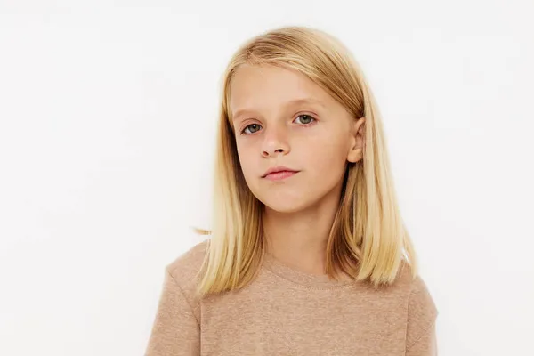 Portrait of a smiling little cutie gestures with his hands posing studio — Stock Photo, Image