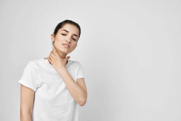 Woman holding on to the neck health care isolated background — Stock Photo, Image