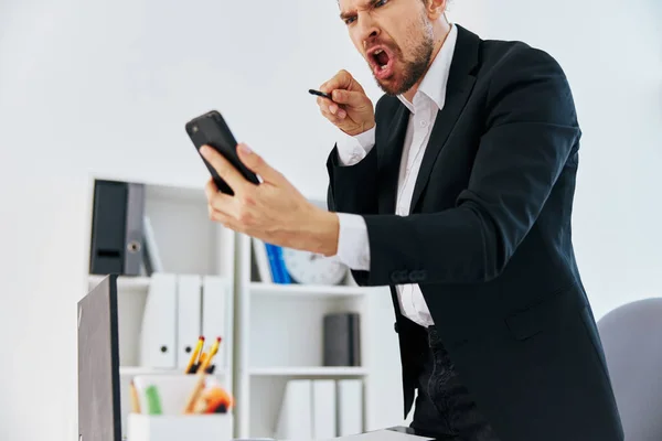 Office worker office work documents with a phone in hand boss — Stock Photo, Image