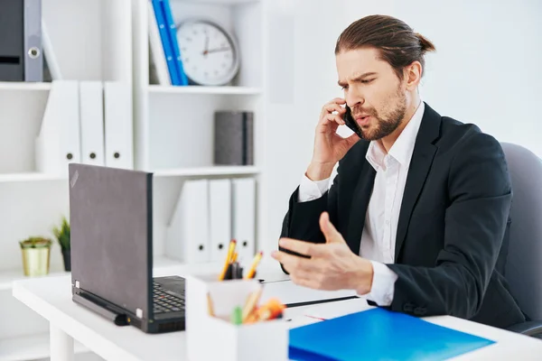 Manager at the desk documents communication by phone boss — Stock Photo, Image