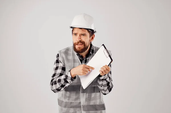 engineer with documents and drawings on  light background. High quality photo