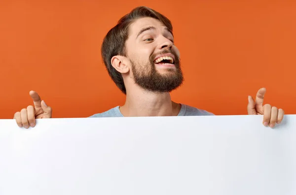 Funny man holding a mockup poster discount isolated background — Stock Photo, Image