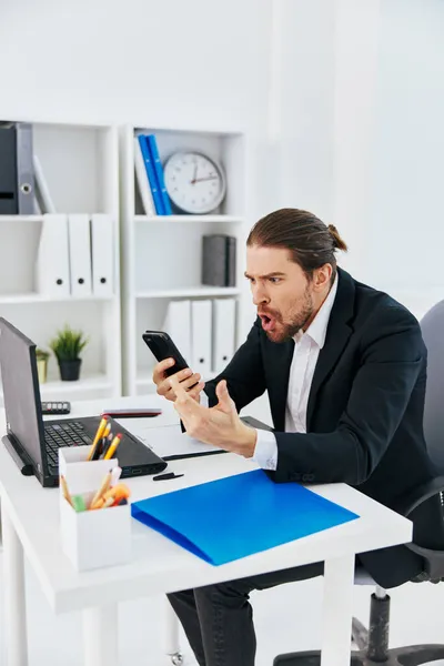 Manager office work documents with a phone in hand boss — Stock Photo, Image