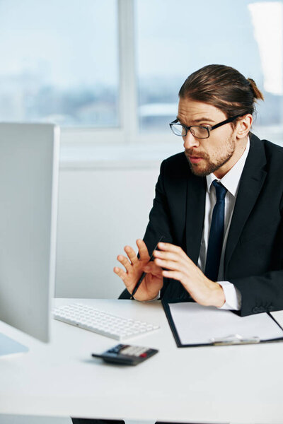 man in a suit in a suit office work phone technologies