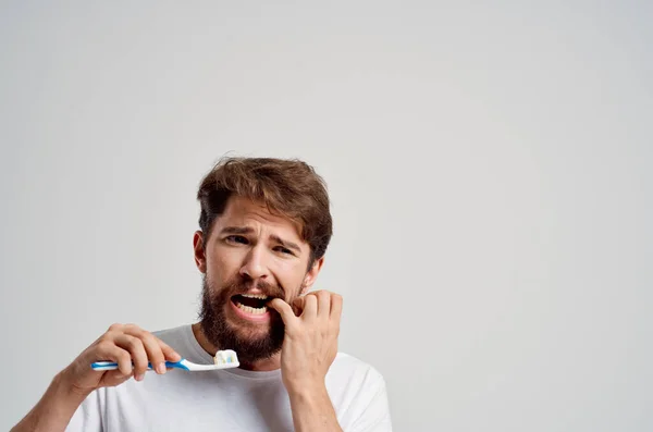 Bearded man toothbrush in hand hygiene clean teeth isolated background — Stock Photo, Image