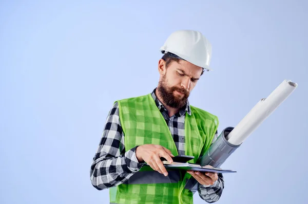 Engineer with documents and drawings blueprints isolated background — Stock Photo, Image