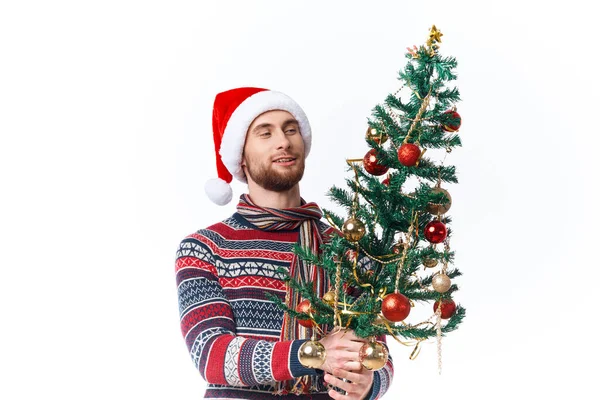 Alegre hombre en un sombrero de santa Navidad decoraciones vacaciones Año Nuevo aislado fondo — Foto de Stock