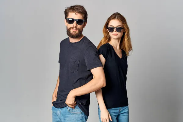 Fashionable man and woman friendship communication romance wearing sunglasses isolated background — Stock Photo, Image