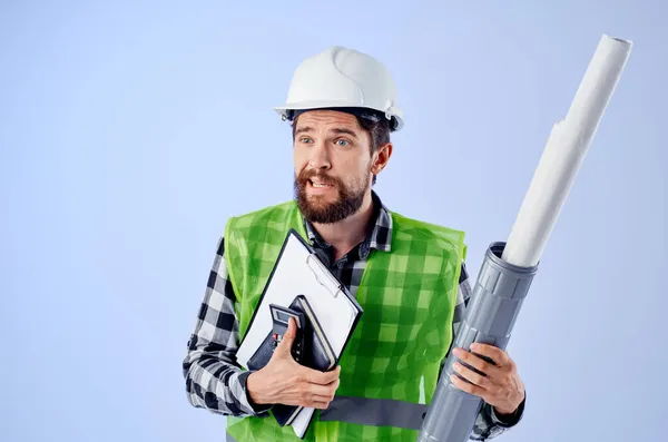 Male builder in a white helmet blueprints Professional studio industry — Stock Photo, Image