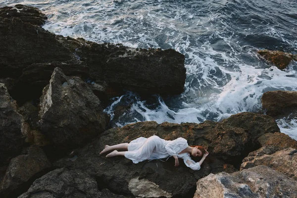 Woman in white wedding dress on sea shore wet hair vacation concept — Stock Photo, Image