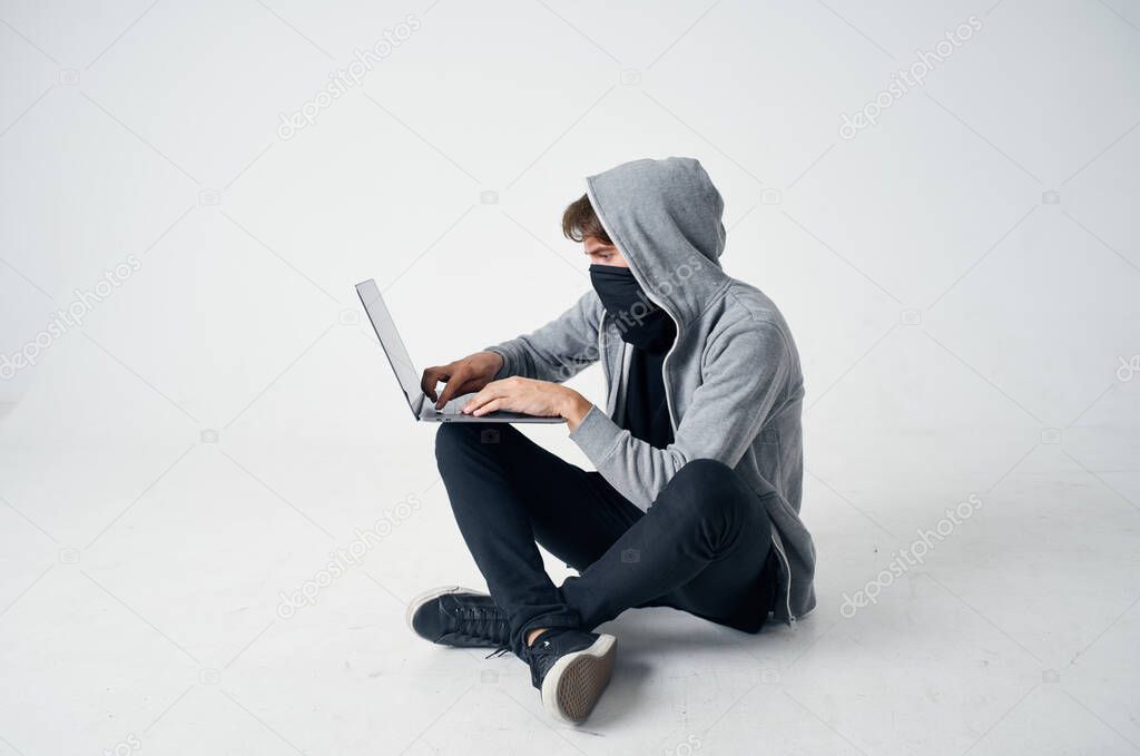 hacker stealth technique robbery safety hooligan light background